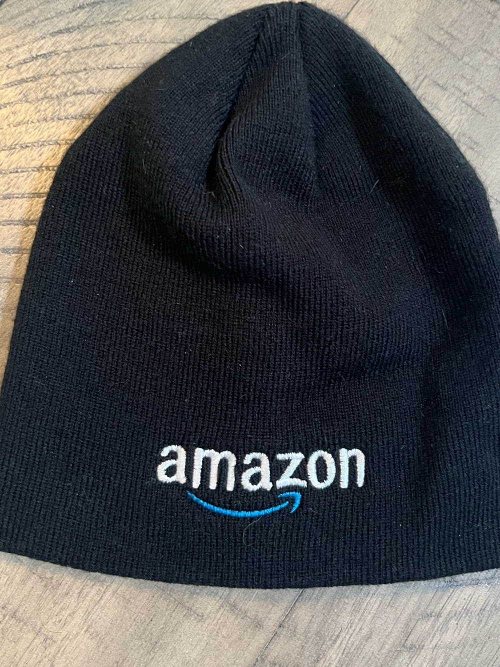 Amazon Black Knit Beanie with White Logo and Blue Arrow.  0004